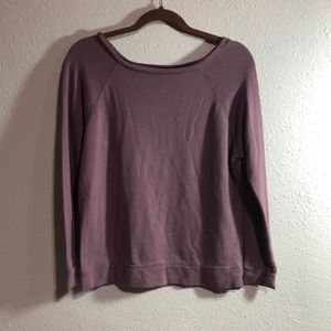 Plain purple long sleeve sweater.